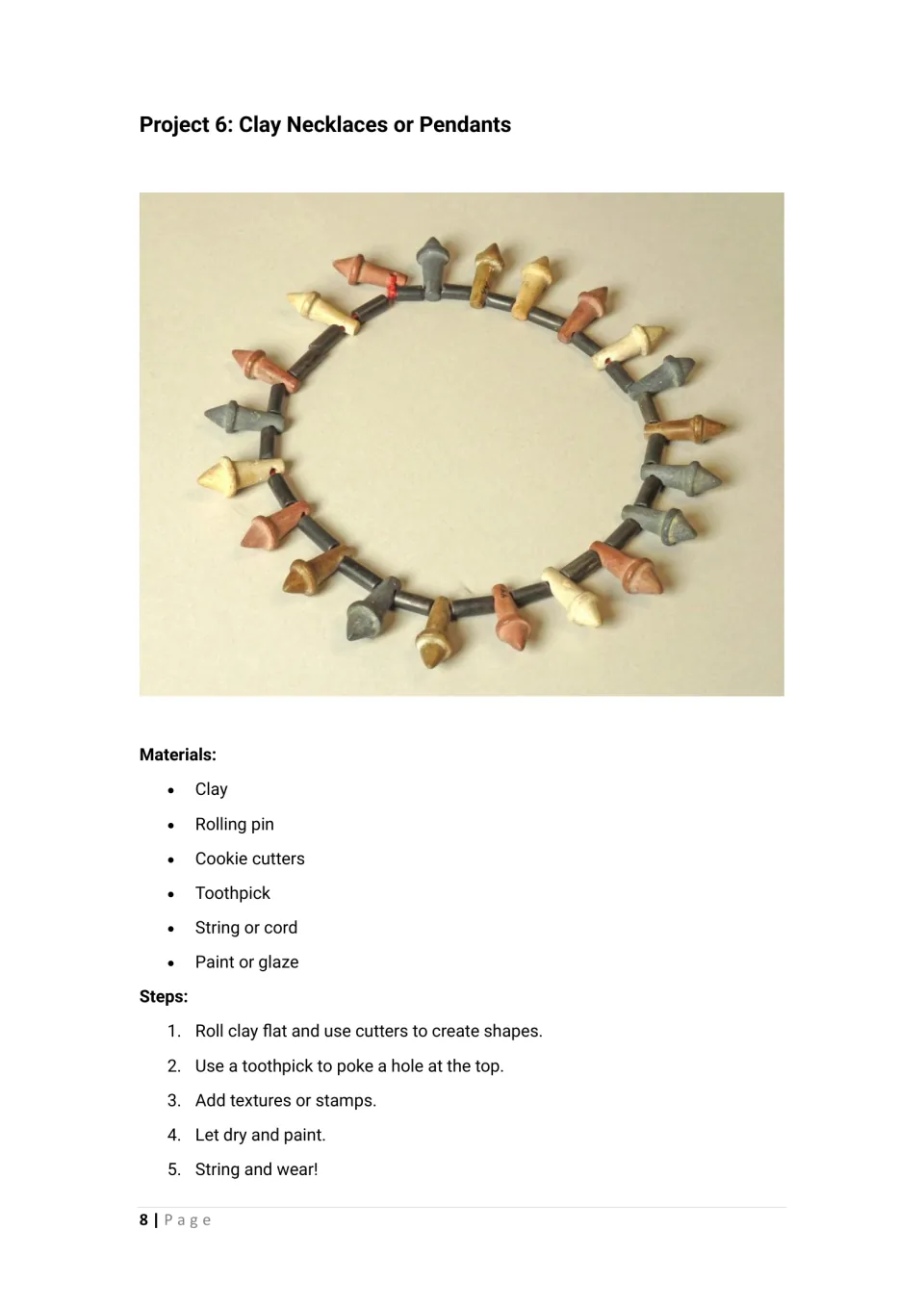 Clay necklaces or pendants: students cut shapes with cookie cutters, poke a hole, paint and string them; necklace photo