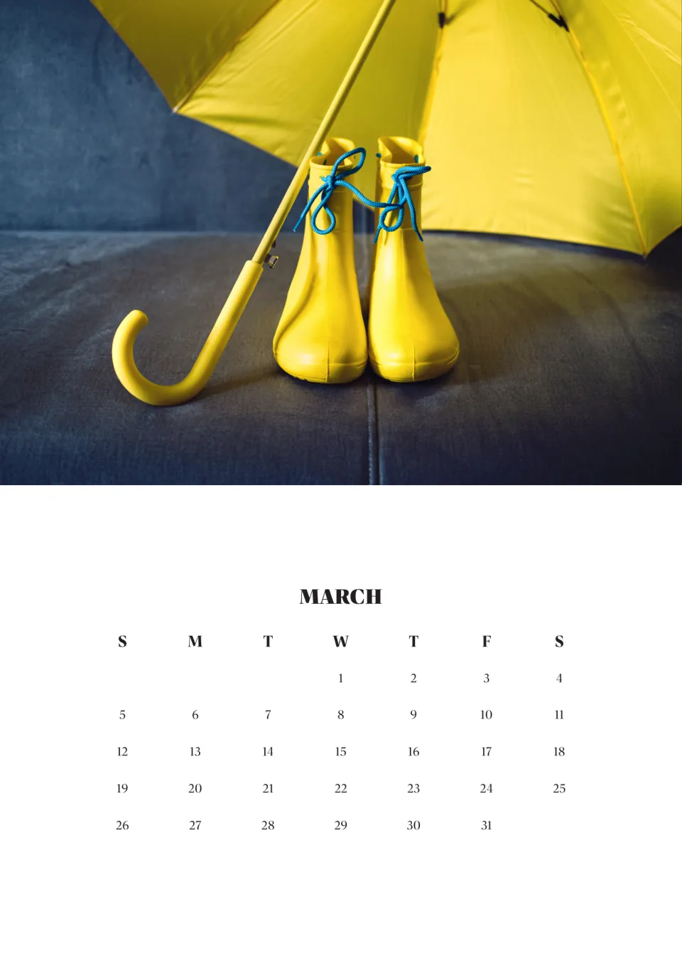 March 2023 month page, Wednesday the 1st through Friday the 31st, beneath a photo of yellow boots and a yellow umbrella
