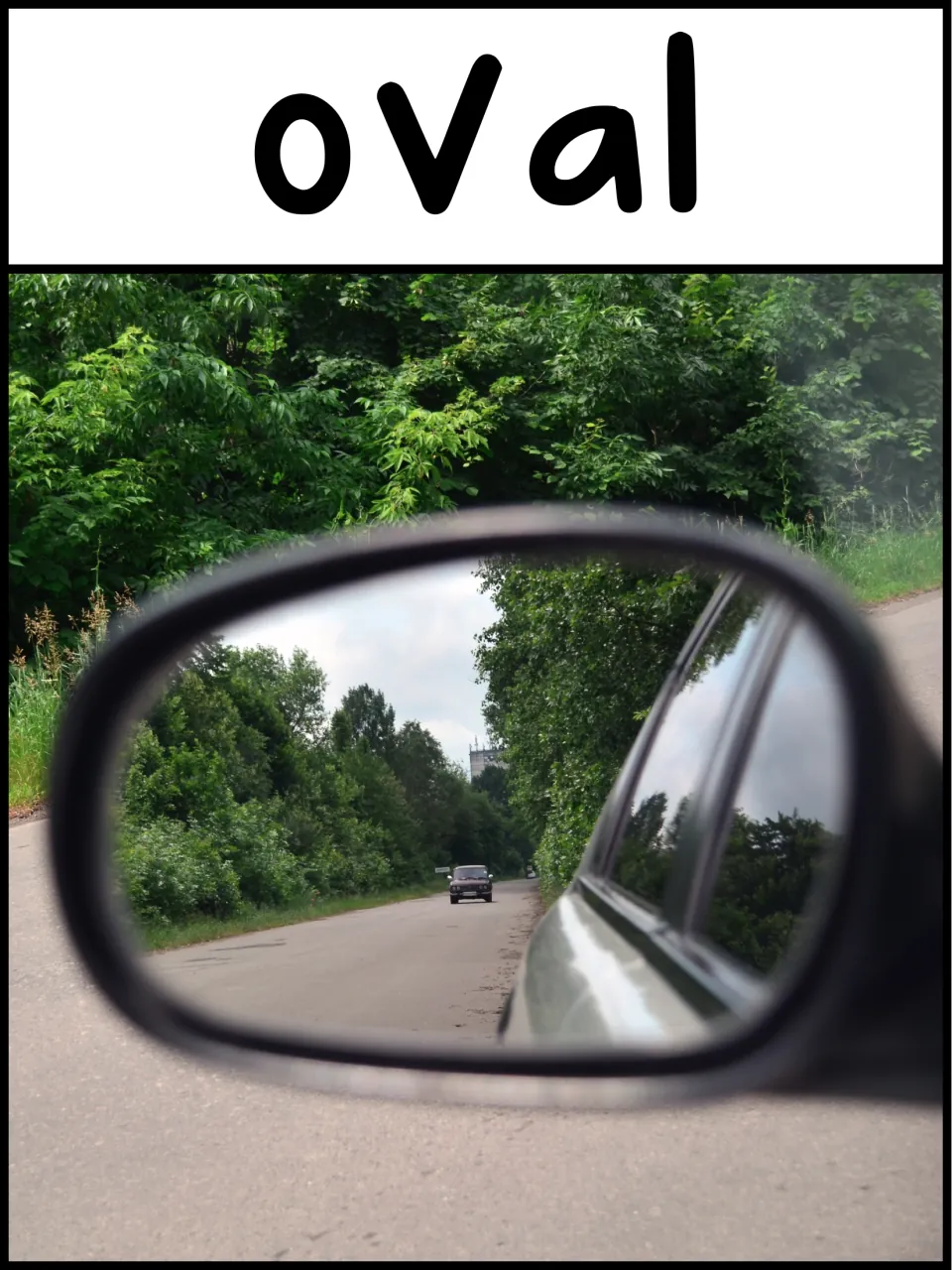 Oval shape poster: a car side mirror reflecting a tree-lined road shows students an oval in daily life