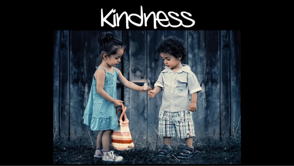 Kindness presentation cover showing a girl offering a small flower to a boy beneath the title “Kindness.”