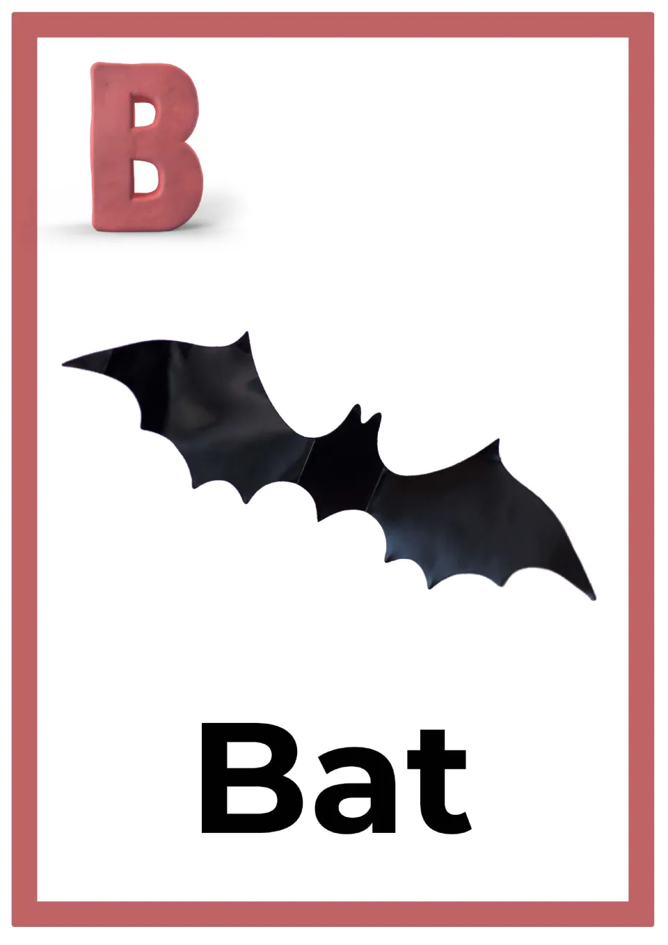 Letter B alphabet card: a pink clay capital B above a black bat with spread wings, labeled with the word Bat