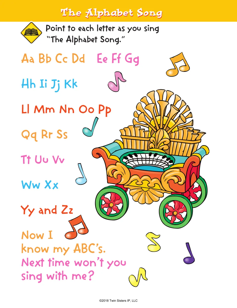 The Alphabet Song: students point to each letter pair from Aa to Zz while singing, shown with a musical organ wagon