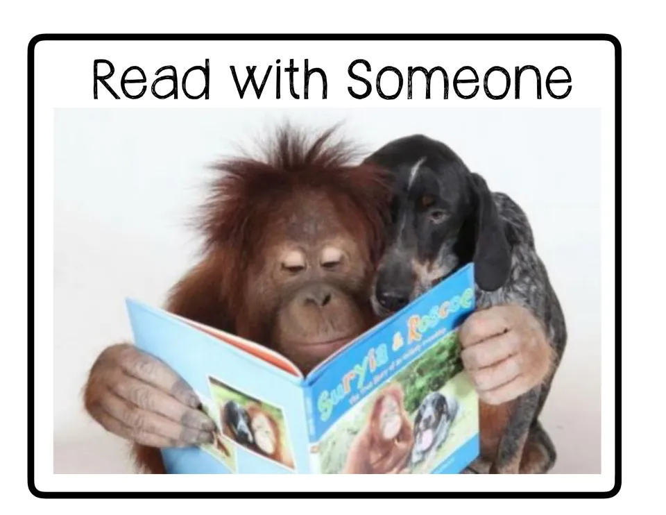 Read with Someone poster in the center rotation set, featuring an orangutan and a dog sharing a book