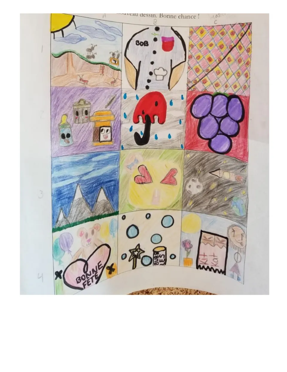 Student example 3: marks turned into a chef's shirt, an umbrella in the rain, grapes and a 'Bonne fête' heart