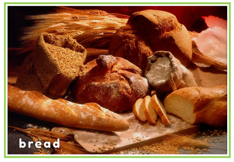 Bread vocabulary card: the printed word bread on a photo of baguettes and loaves so students match the word to the picture