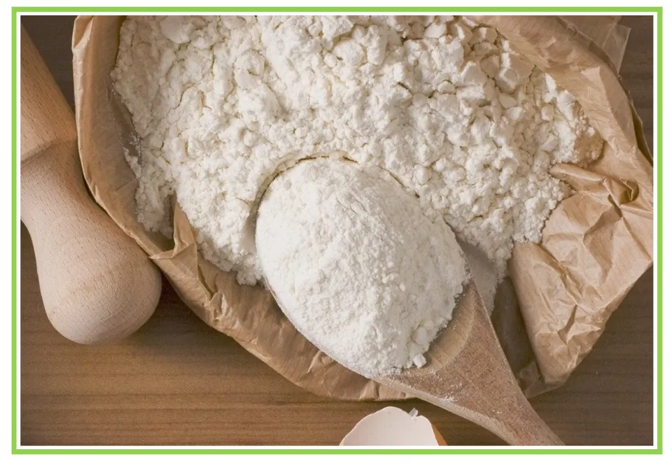 Flour vocabulary card, picture only: a photo of white flour in brown paper with a wooden spoon and rolling pin to name