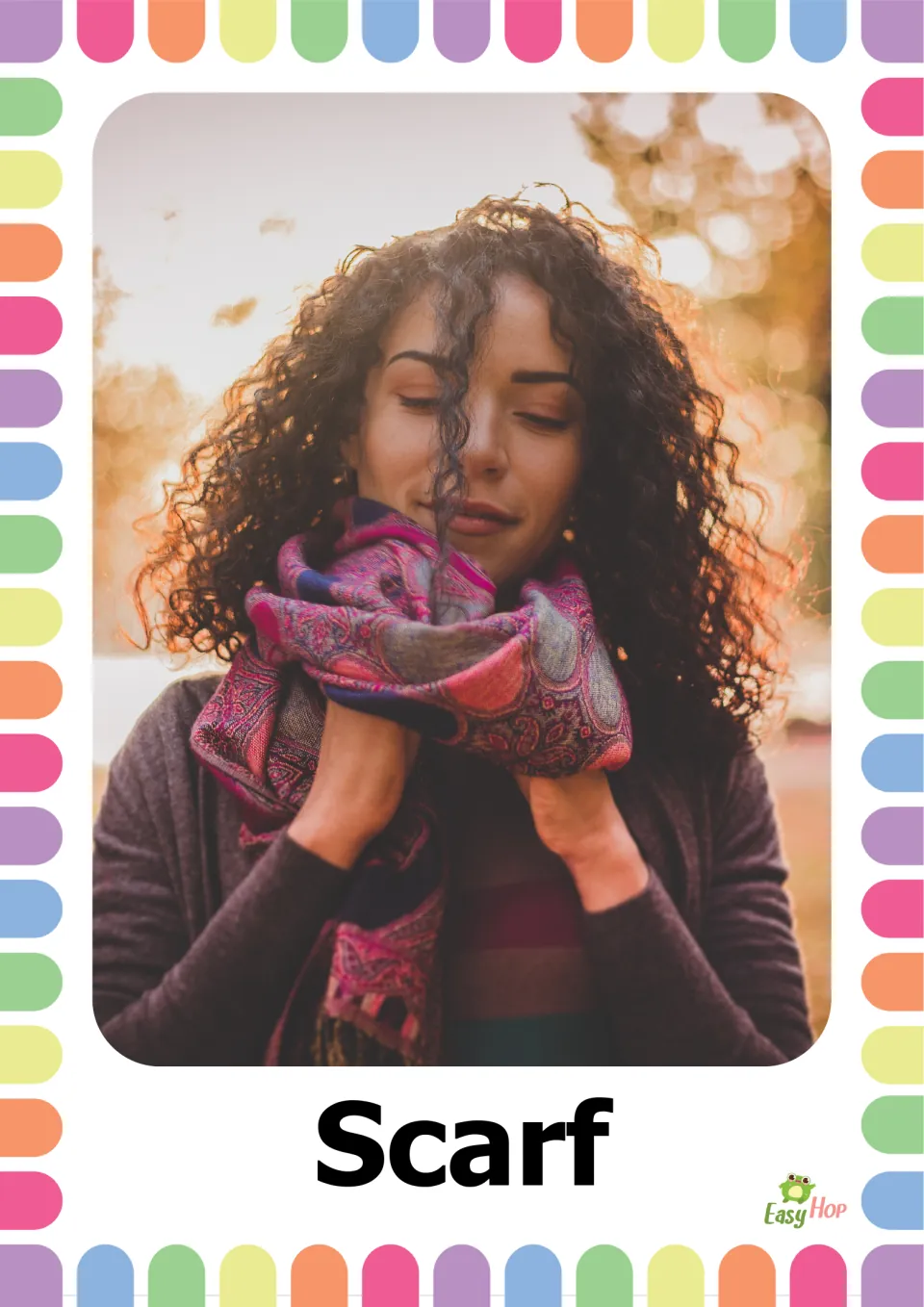 Autumn clothing vocabulary flashcard 4: the word 'Scarf' paired with a person wearing a patterned scarf
