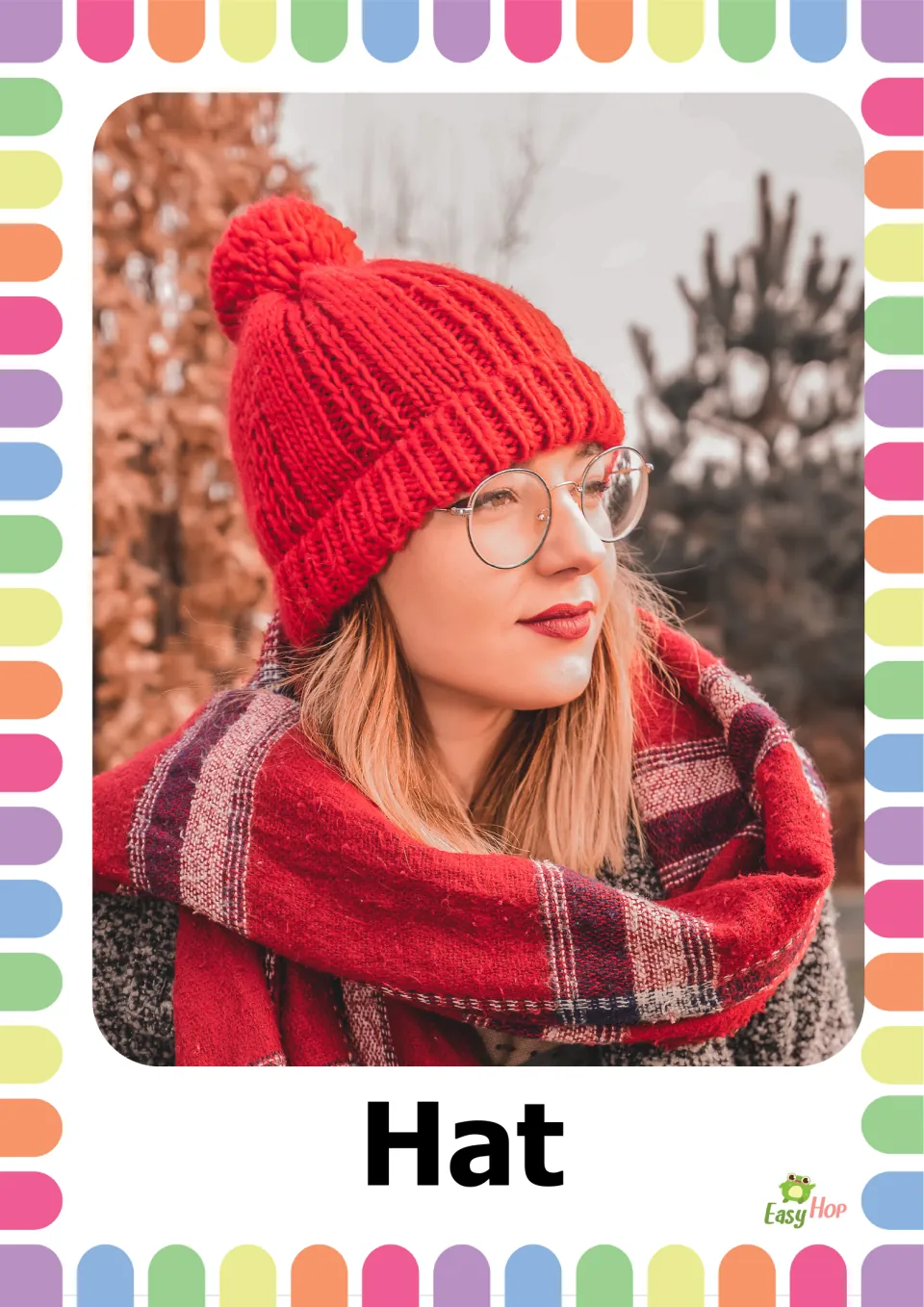 Autumn clothing vocabulary flashcard 6: the word 'Hat' paired with a person wearing a red knit pom-pom hat
