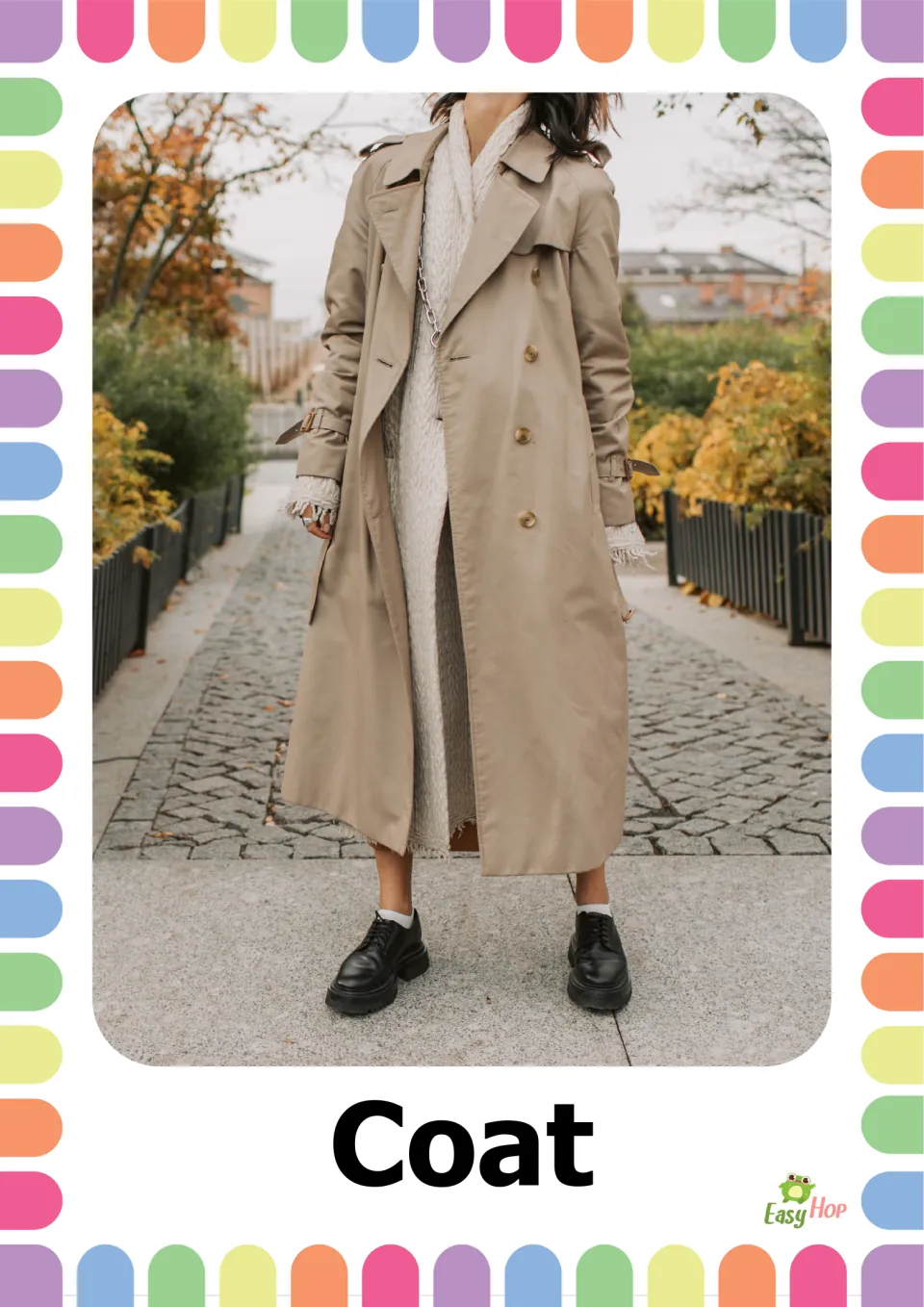 Autumn clothing vocabulary flashcard 10: the word 'Coat' paired with a person wearing a long beige coat
