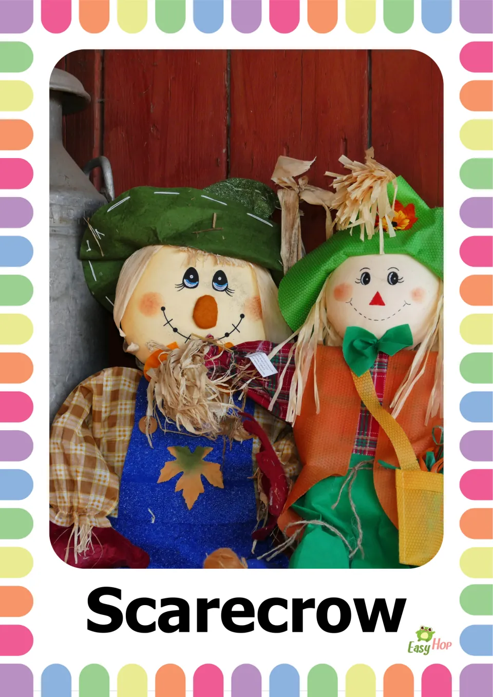 Autumn vocabulary flashcard 5: the word 'Scarecrow' beneath a photograph of two scarecrows wearing green hats