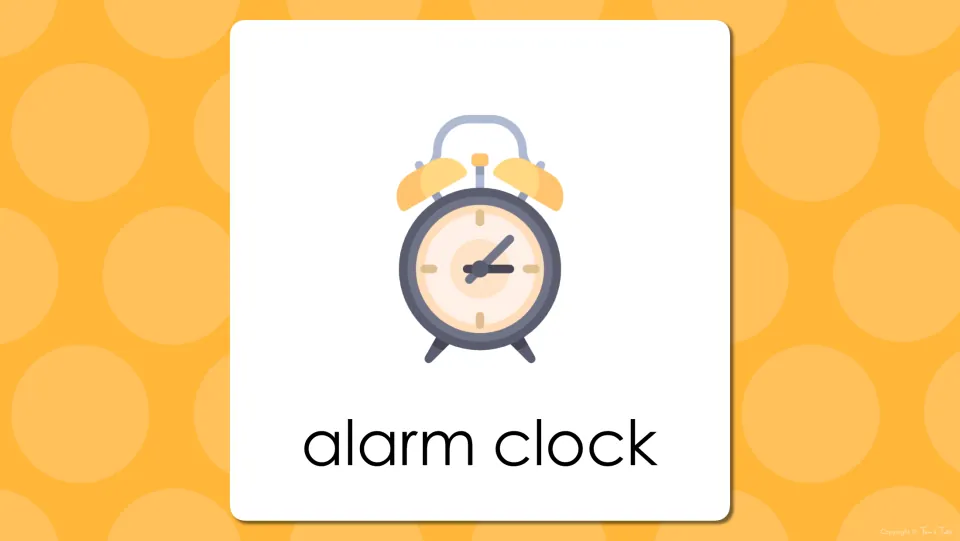Bedroom vocabulary presentation slide pairing the words “alarm clock” with the preceding slide's illustration
