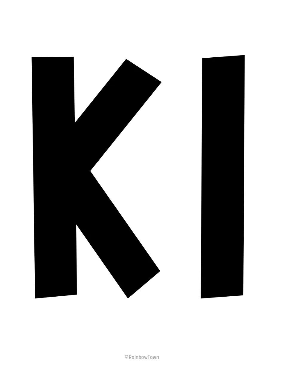 K and I cut-outs: two full-page black capitals that begin the word "Kind" in the bulletin board banner phrase
