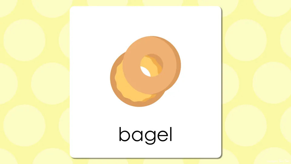 Breakfast vocabulary slide with the word bagel under a picture of two bagels, revealing the answer to the prior slide