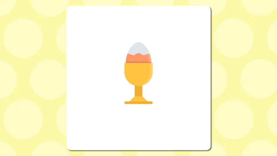 Picture-only slide of a cracked egg sitting in a yellow egg cup, letting students name the breakfast food before the label