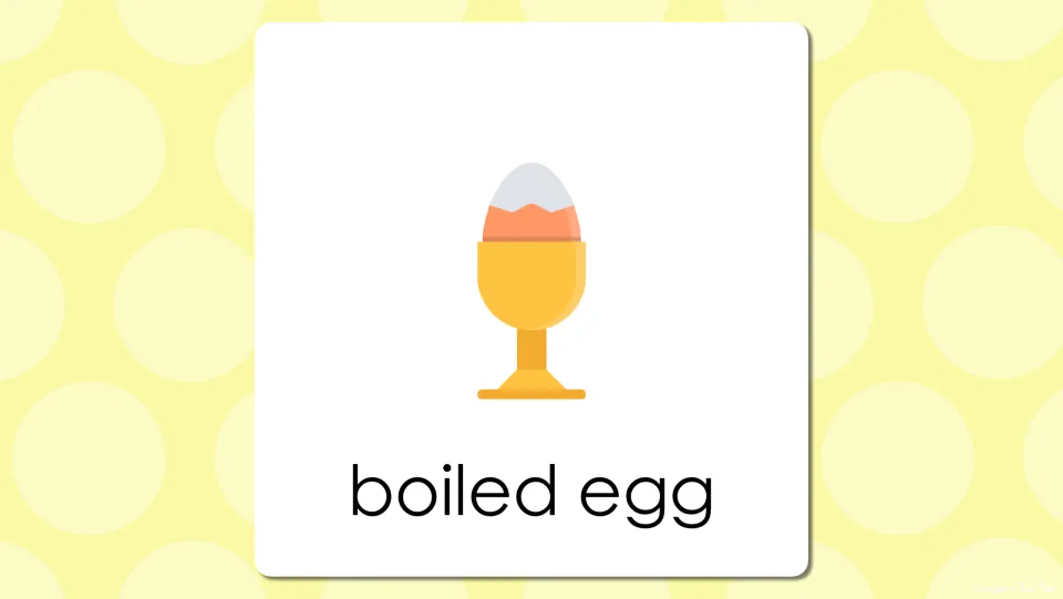 Breakfast word slide labeling an egg in a yellow egg cup as boiled egg, a two-word vocabulary term for students to read