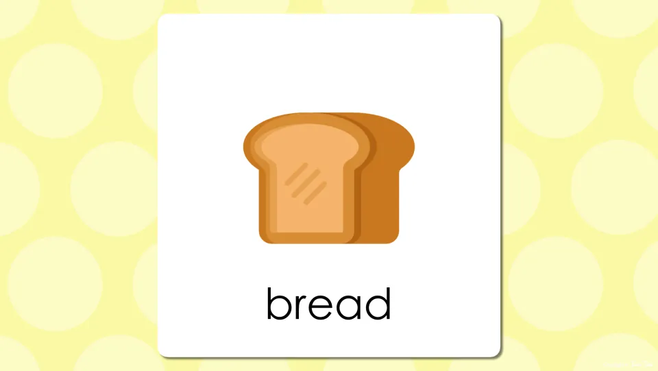 Breakfast vocabulary slide with a loaf and slice of bread above the printed word bread for students to read and repeat