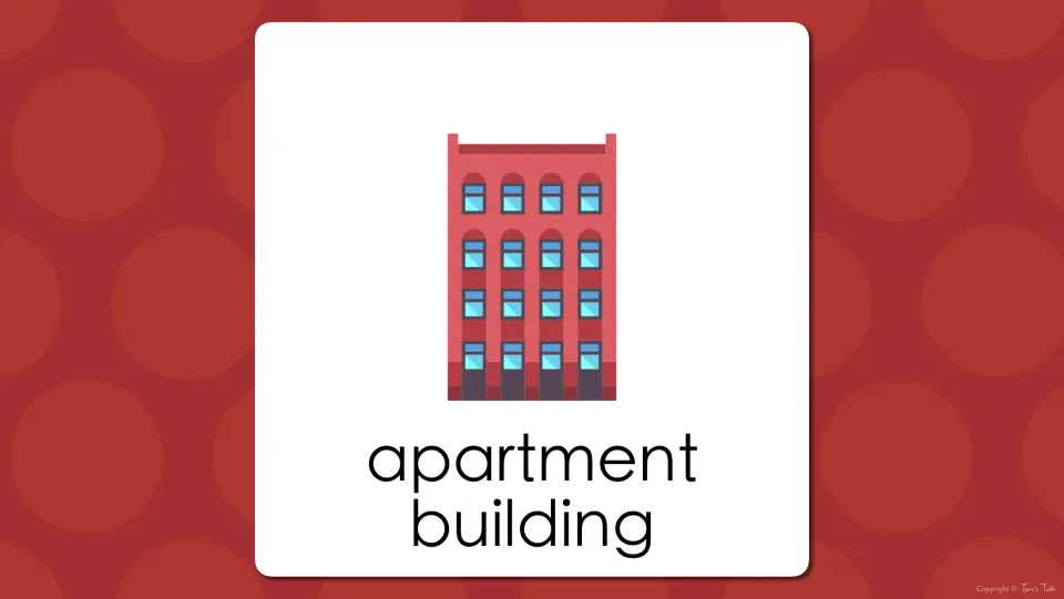 Building vocabulary presentation slide showing the words “apartment building” beneath the matching illustration