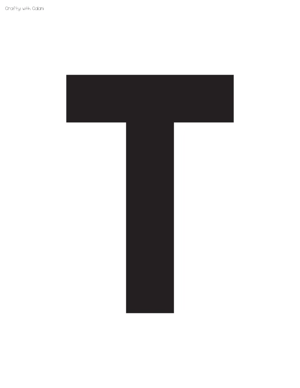 Black capital T that begins the word TO after WELCOME, a single large letter to cut out for the Halloween heading