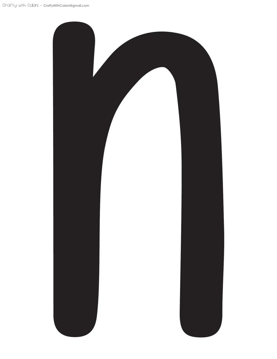 Bulletin board letter n: a full-page black lowercase n in rounded handwritten style, finishing the word In on the display