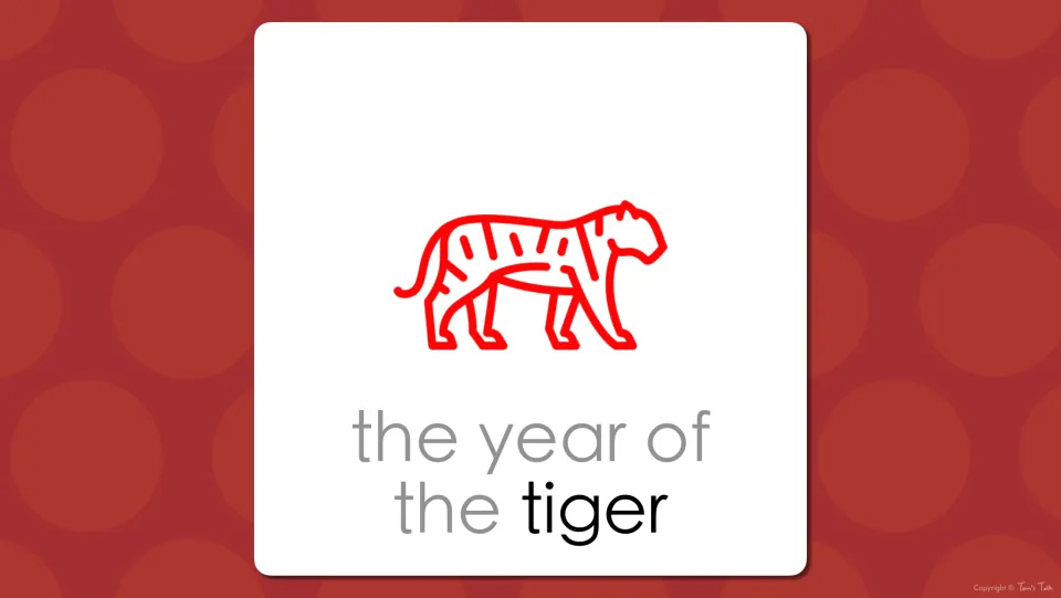 Zodiac vocabulary slide: the red tiger drawing labeled 'the year of the tiger', linking the image to the bold word tiger