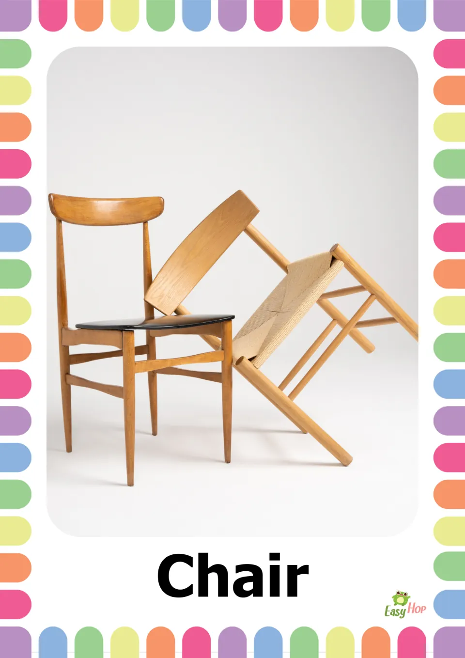 Chair word card: a photo of two wooden chairs, one upright with a black seat and one tipped over, labeled Chair