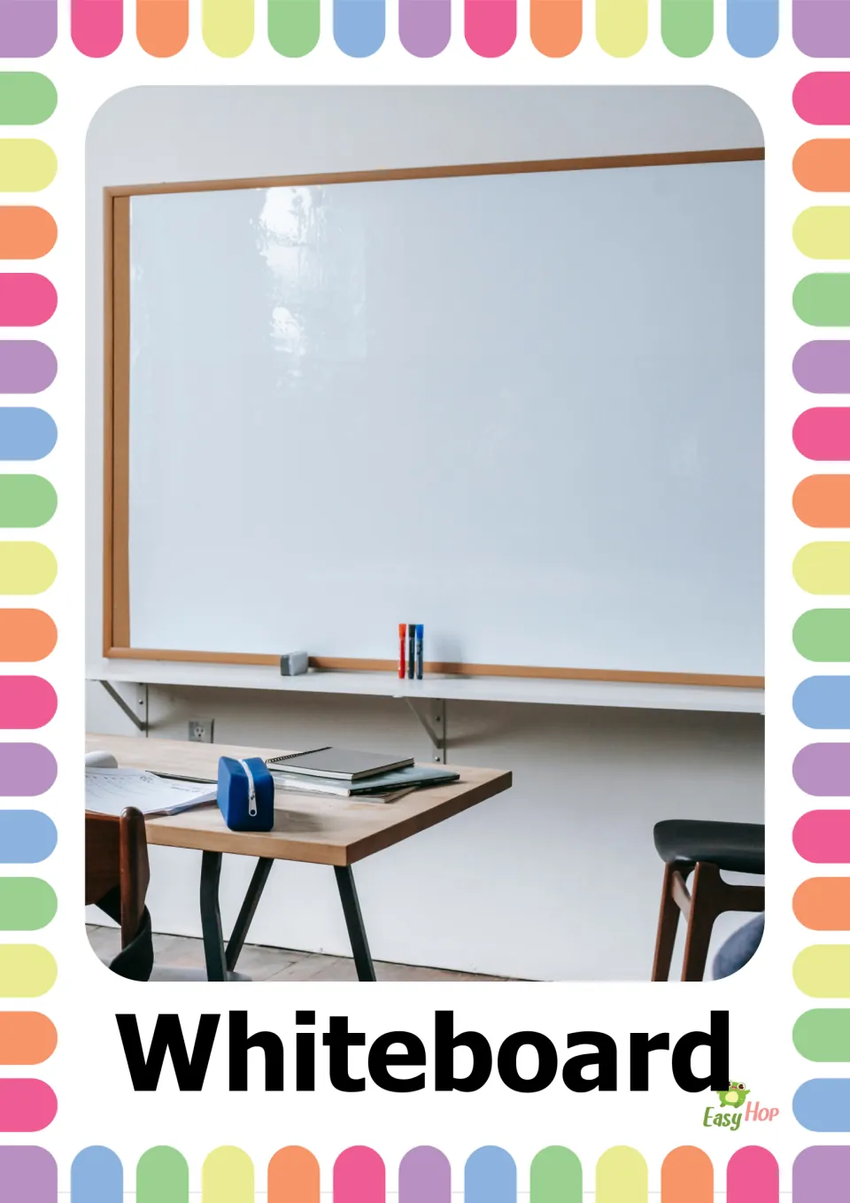 Whiteboard picture card: a photo of a blank wall whiteboard with markers and an eraser on its ledge above a desk