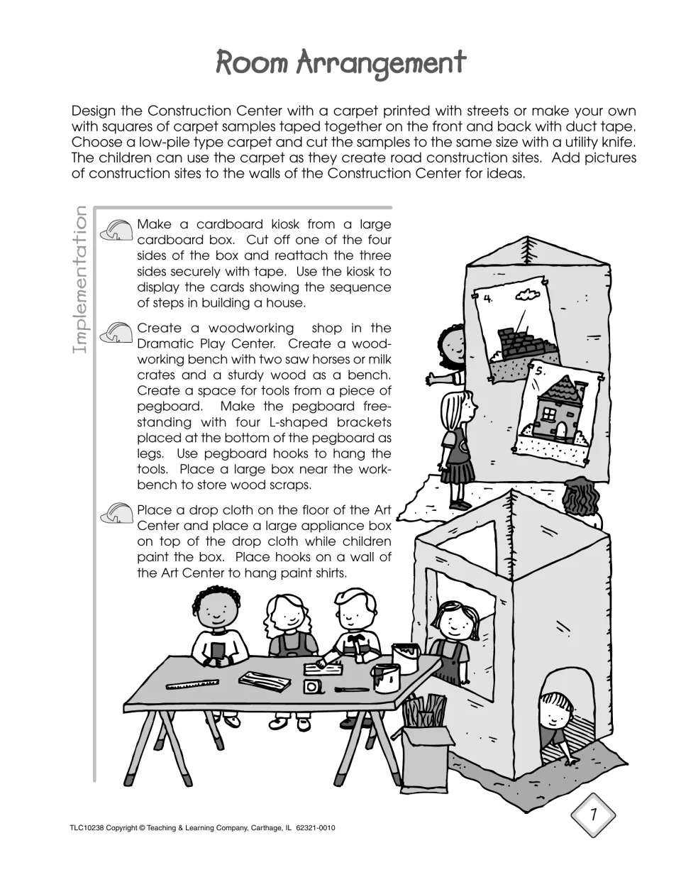 Room setup ideas: road-print carpet, cardboard kiosk for house-building steps, woodworking bench and box-painting area