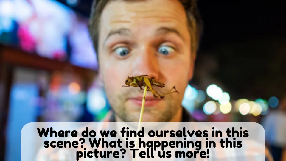 Picture description 1: students say where and what is happening as a man stares cross-eyed at an insect on a skewer