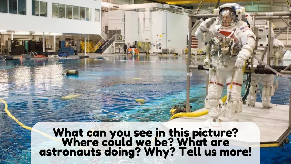Picture description: students guess where a suited astronaut stands by an indoor pool and what astronauts are doing