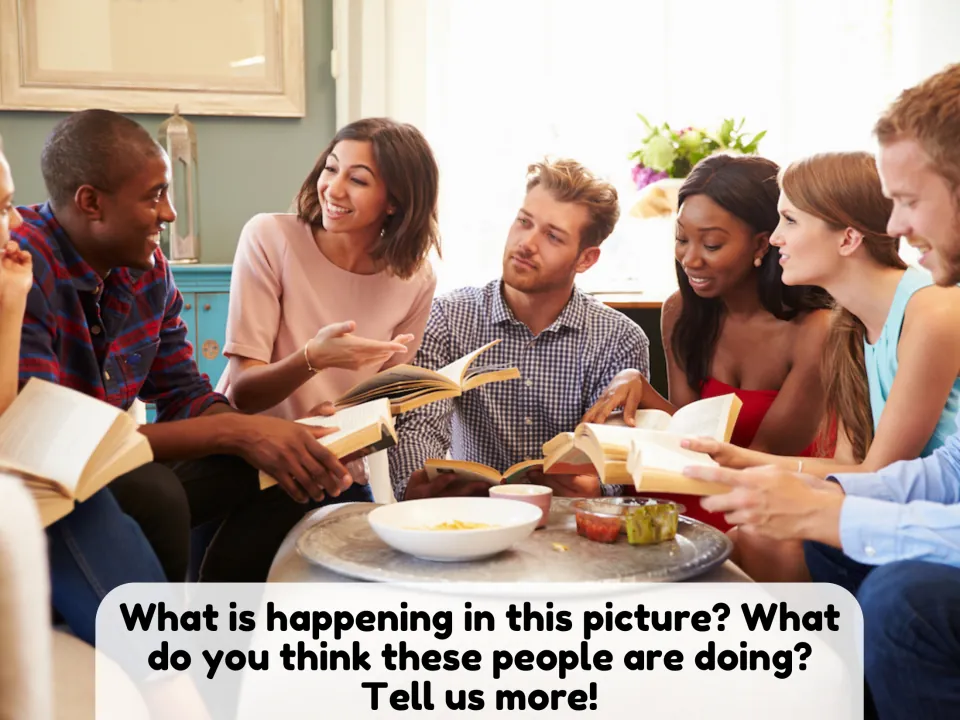 Picture description: students explain what a group of adults sitting around a table with open books are doing together