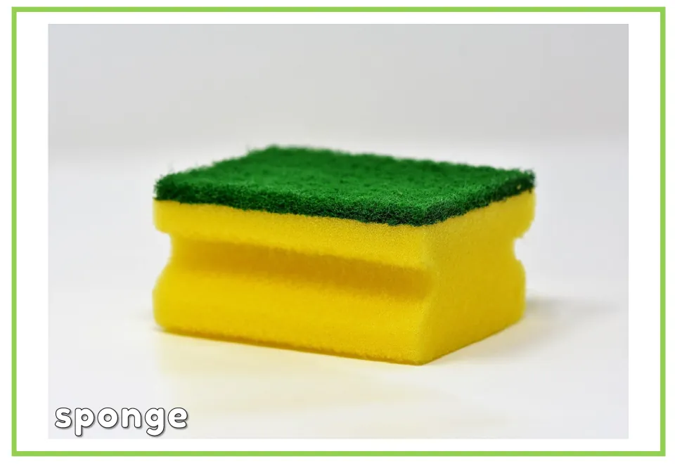 Labeled cleaning vocabulary flashcard showing a yellow sponge with a green scrub pad and the word 'sponge'