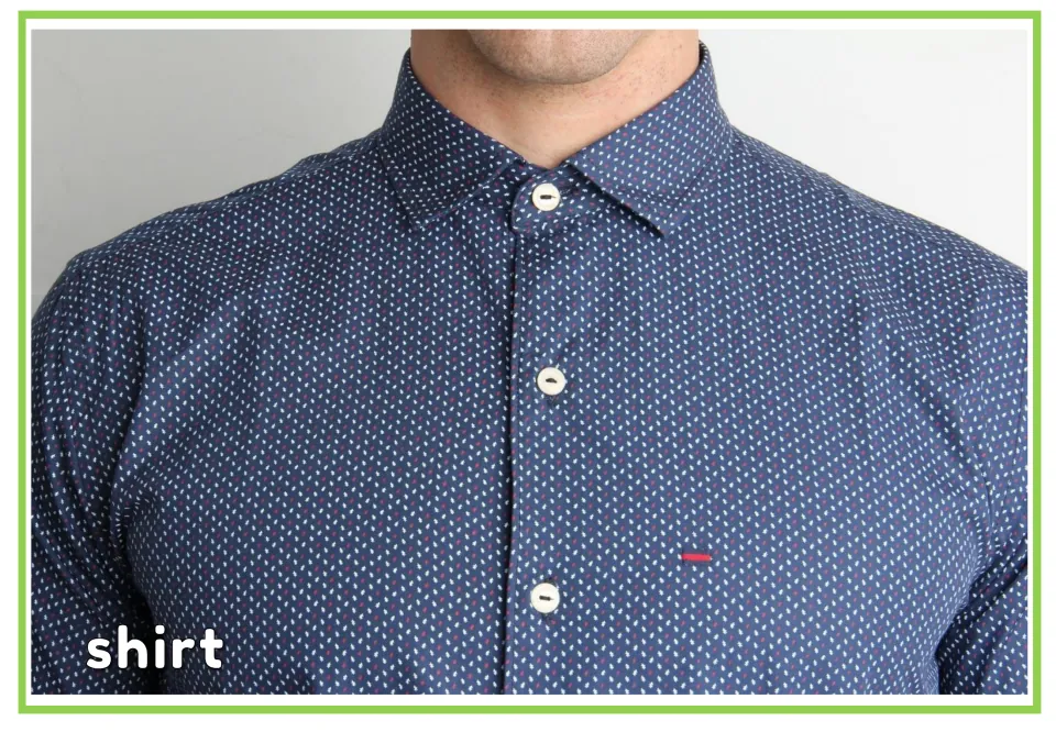 Labeled clothing vocabulary flashcard showing a navy patterned shirt with white buttons and the word 'shirt'