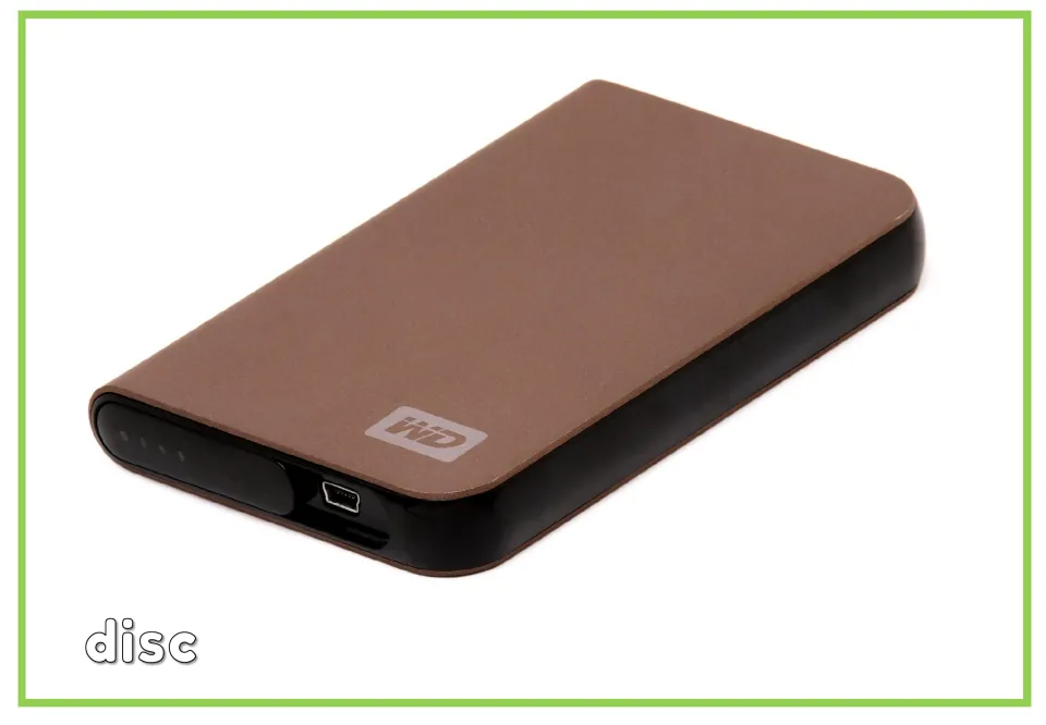 Labeled computer vocabulary flashcard showing an external hard drive with the word disc beneath it