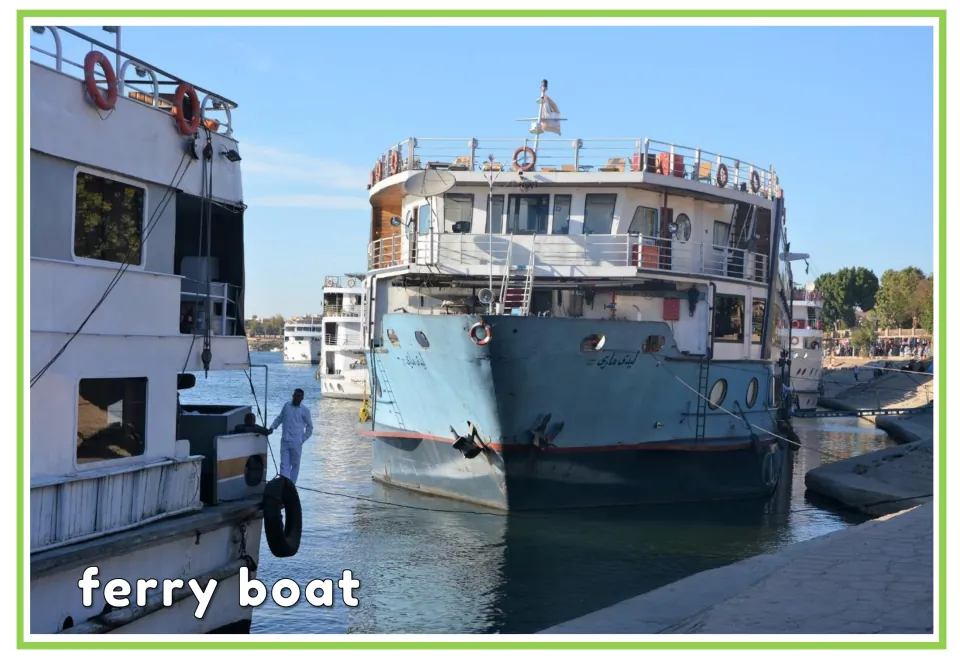 Labeled watercraft vocabulary flashcard showing a ferry docked beside other boats with the words 'ferry boat'