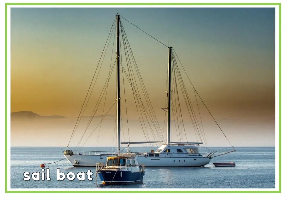 Labeled watercraft vocabulary flashcard showing a two-masted sailboat at anchor with the words 'sail boat'
