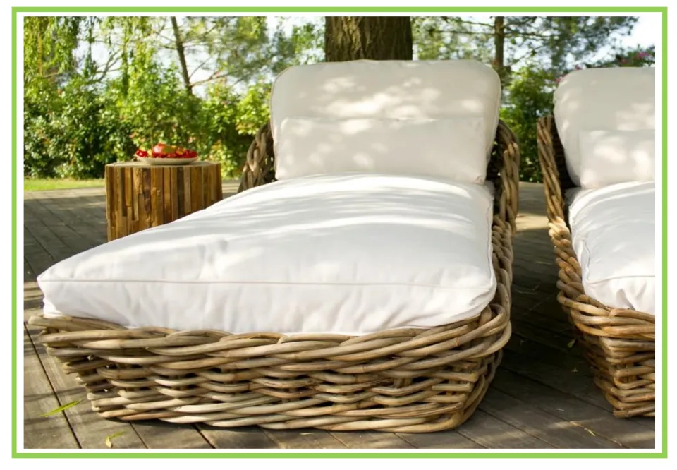 Picture-only garden vocabulary flashcard showing a woven deck chair with white cushions on a wooden deck