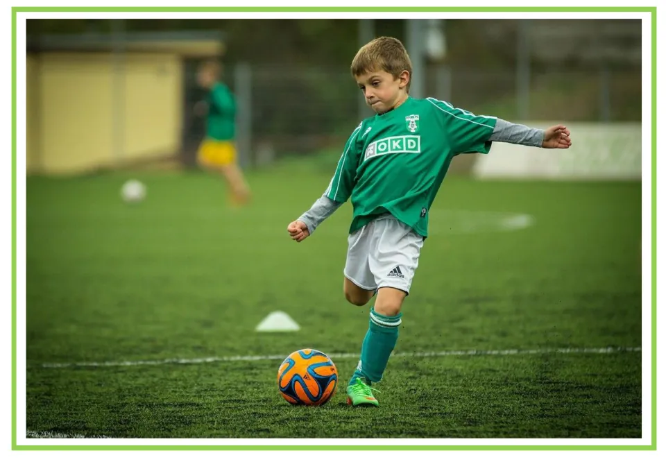 Picture-only hobbies vocabulary flashcard showing a child kicking a soccer ball, paired with the sports card