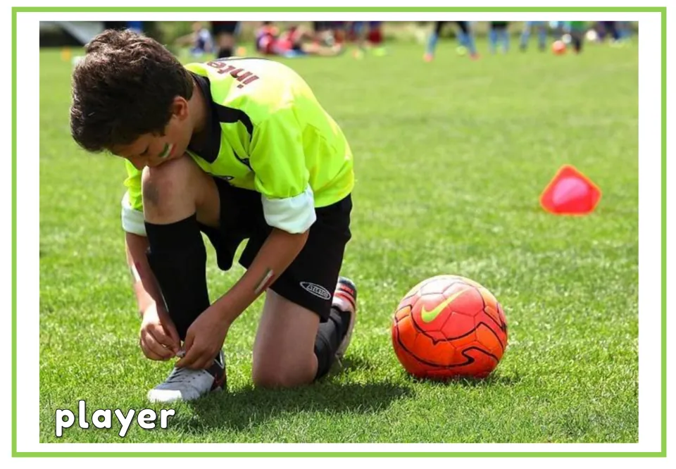 Labeled soccer vocabulary flashcard showing the word player and a child tying a shoe beside a soccer ball
