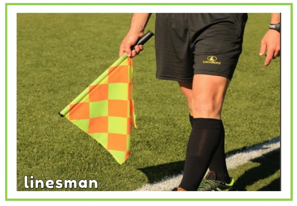 Labeled soccer vocabulary flashcard showing the word linesman and an official holding a checkered flag