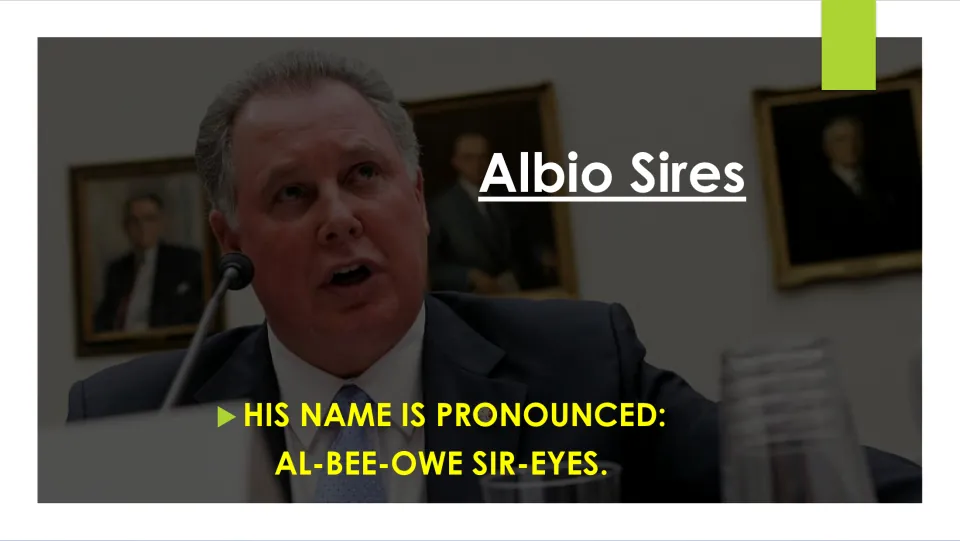 Biography slide giving the pronunciation of Albio Sires’ name as “AL-BEE-OWE SIR-EYES,” with a hearing photo