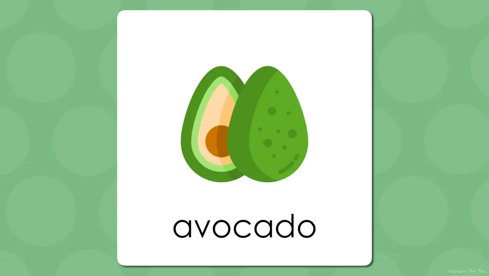 Fruit vocabulary presentation slide showing an avocado and a cut half with the vocabulary label 'avocado'