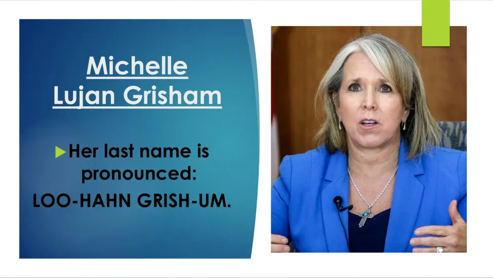 Biography pronunciation slide giving Michelle Lujan Grisham’s last name as “LOO-HAHN GRISH-UM,” beside her portrait