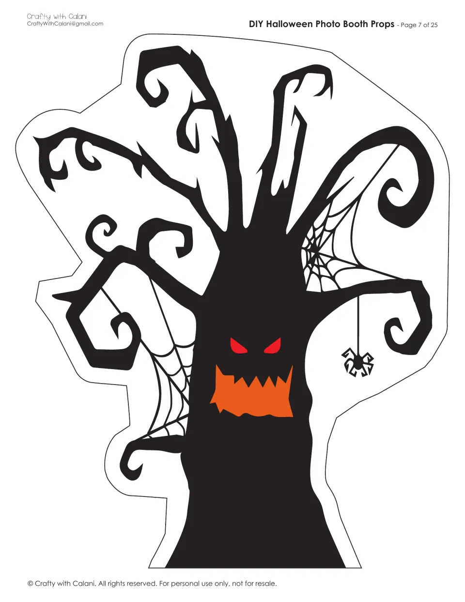 Haunted tree cut-out: a black twisted tree with red eyes, a jagged orange mouth, cobwebs and a dangling spider