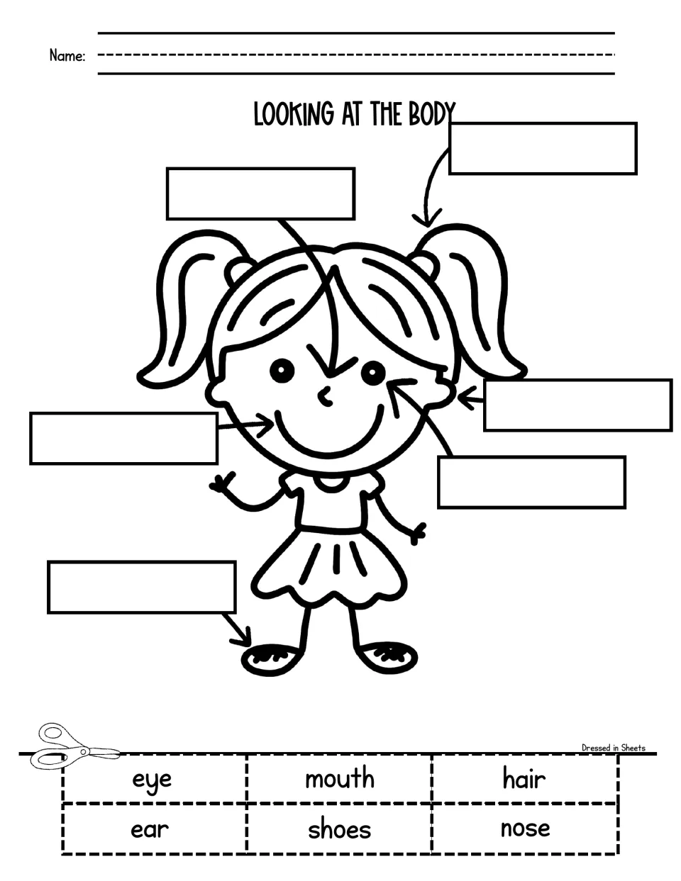 Body parts: students label a smiling girl's eye, ear, nose, mouth, hair and shoes by gluing cut-out word cards