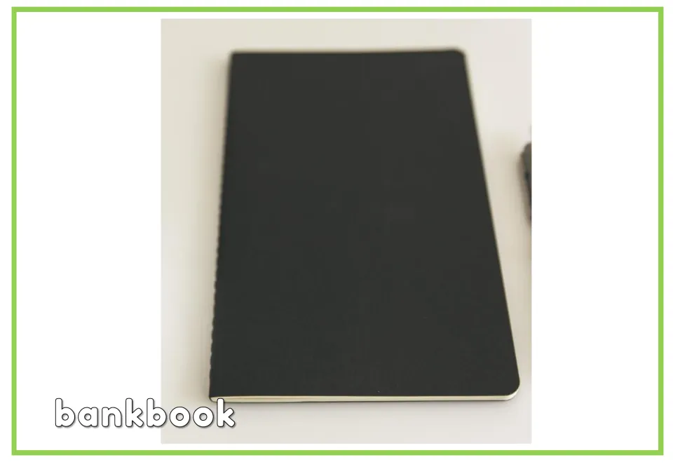 Labeled banking vocabulary flashcard showing a closed black booklet paired with the English word "bankbook"
