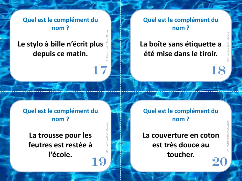 French noun complement task cards 17–20: sentences about a ballpoint pen, unlabeled box, marker case, and blanket