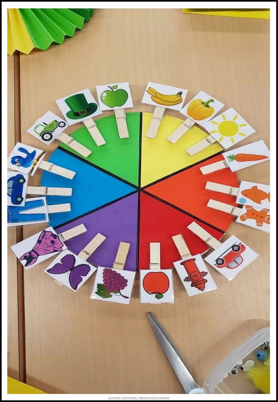 Assembled color-matching activity example showing picture cards on clothespins attached to a six-color wheel.