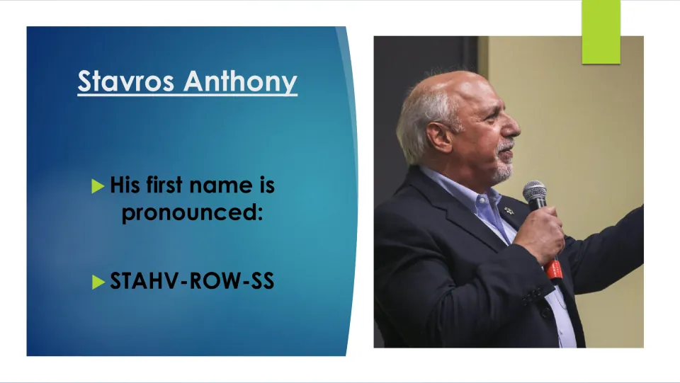 Biography slide giving the pronunciation of Stavros as “STAHV-ROW-SS,” beside a photo of Anthony speaking