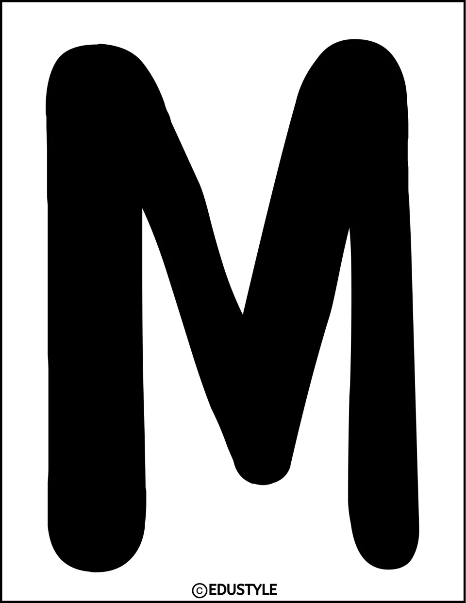 Solid black uppercase M cutout for the word “Make” in the kindness bulletin board or door display title