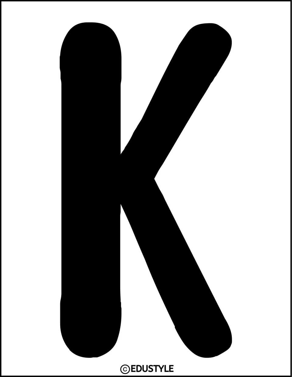 Solid black uppercase K cutout for the word “Make” in the kindness bulletin board or door display title